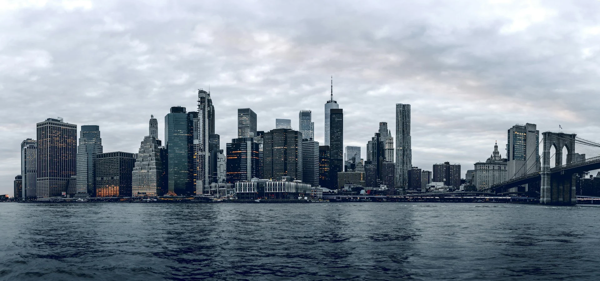 City skyline across the water on a cloudy day