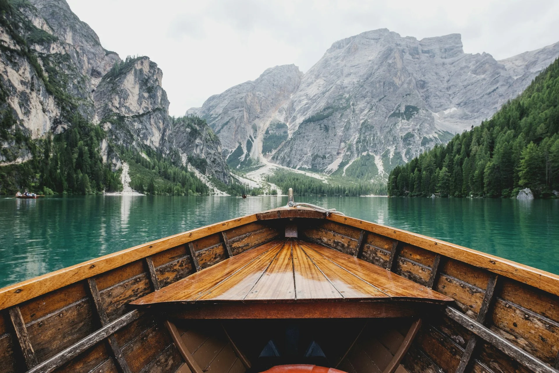 Wooden rowboat on a turquoise alpine lake